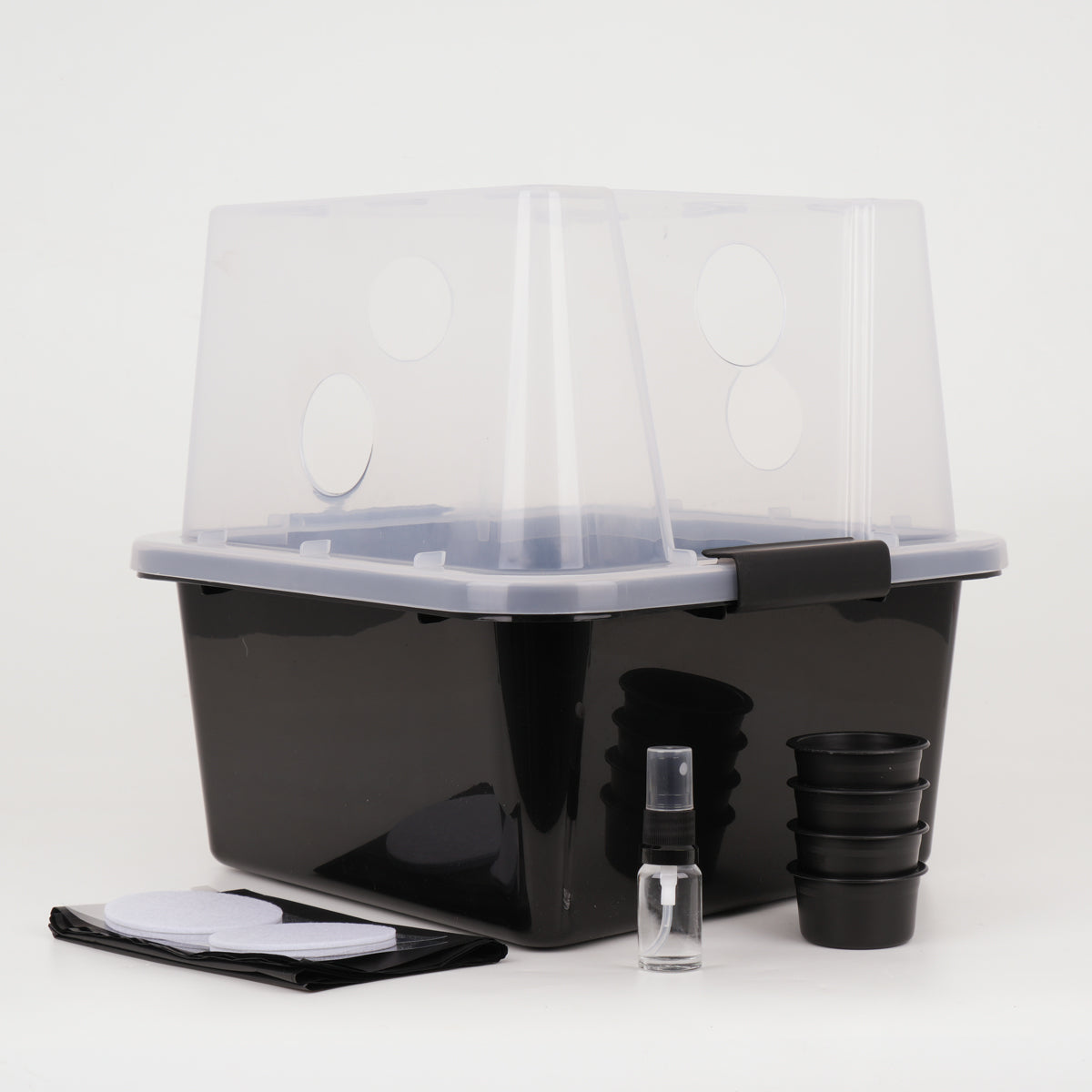 A Microppose Monotub, small, on a white background with accessories